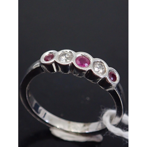 42 - A ruby and diamond ring five stone ring, showing as finger size M