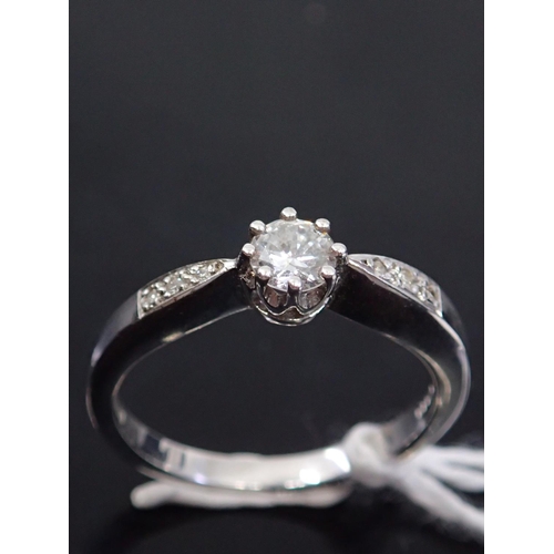 48 - A diamond solitaire ring, showing as finger size N