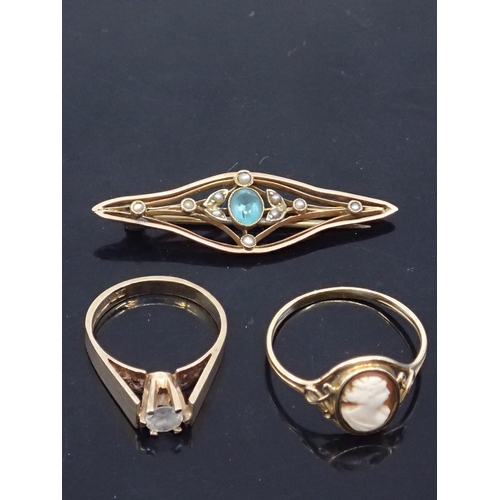 110 - Two rings and a brooch approx. 8.3 grams