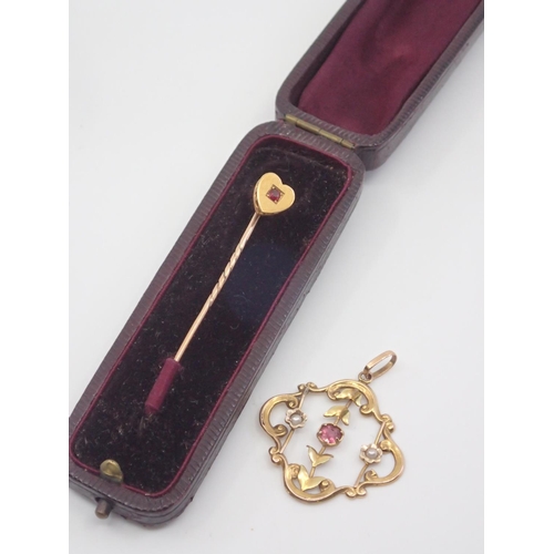 111 - A pin in box and gold brooch