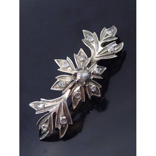 28 - An antique diamond set silver brooch (we note one small diamond is a lab grown diamond)