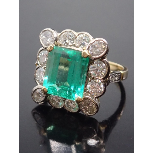 46 - A fine emerald and diamond cluster ring, finger size J, estimated weight of emerald 3.2cts