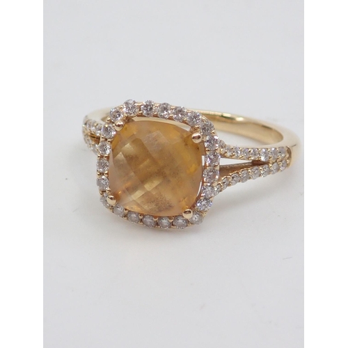 6 - A diamond and citrine ring, showing as finger size L set in 18ct gold