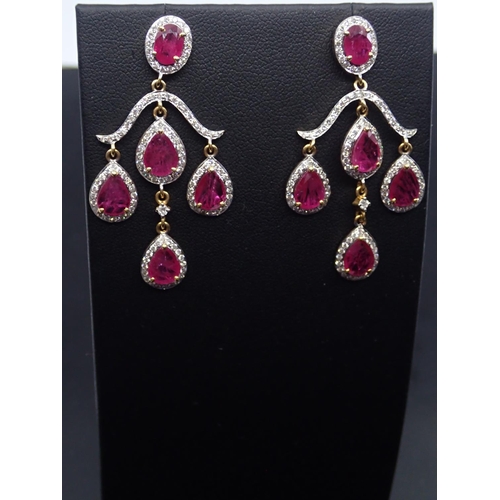 67 - A pair of ruby and diamond cluster drop earrings set in 18ct gold