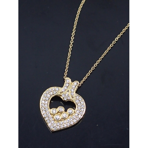 68 - An 18ct gold diamond set heart pendant on chain