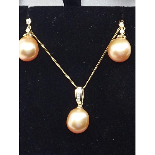 69 - A diamond and pearl set pendant on chain and a pair of matching diamond and pearl earrings all set i... 