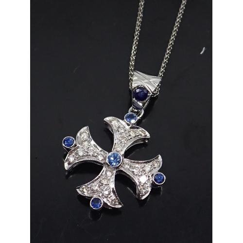 70 - A diamond and sapphire set cross pendant on chain all set in 18ct gold (we note one tiny lab grown d... 