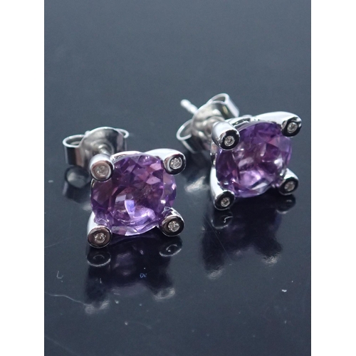 78 - A pair of amethyst and diamond set earrings, in 18ct gold. approx. 3.6 grams