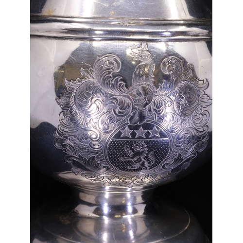 64 - A RARE IRISH SILVER BEER JUG, Dublin c.1726, Matthew Walker, of Baluster form with scroll handle, en... 