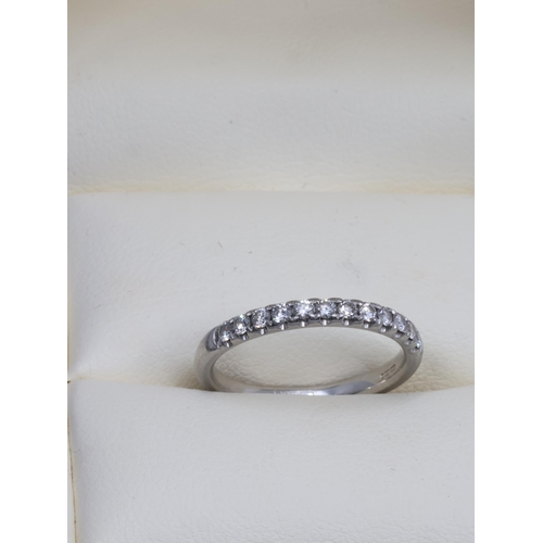 138 - A diamond half eternity ring set in platinum with a copy of an receipt from Weir & Son which states ... 