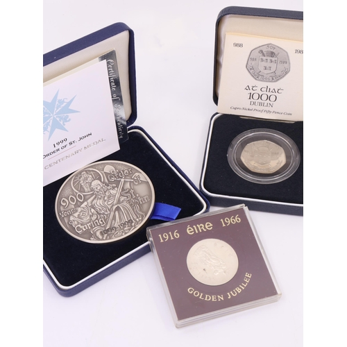 503 - An Irish Ten shilling coin and 1988 50 pence coin and a 1999 Silver Centenary Medal of the Order of ... 