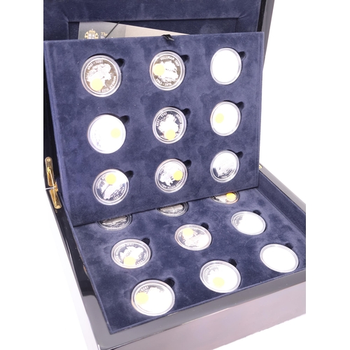 506 - A boxed set of 18 silver crowns each depicting a classic British motorcar each are approx. 28.28 gra... 