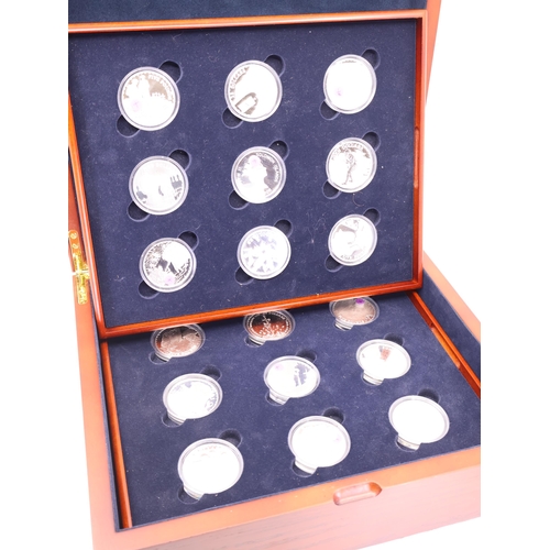 507 - A boxed set of 18 silver crowns each depicting a scene from World War 1, each are approx. 28.28 gram... 