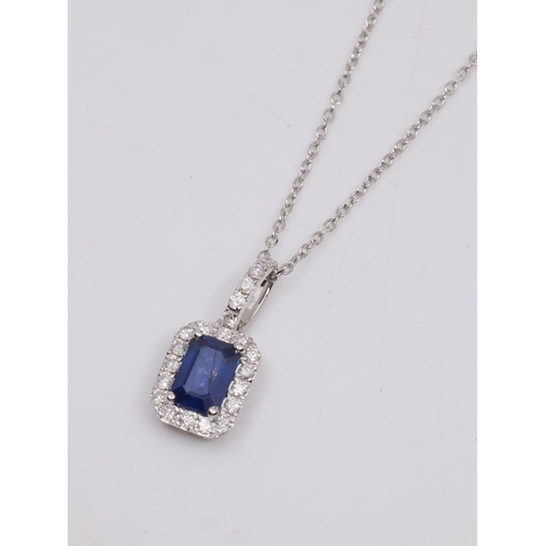 32 - A 18ct white gold sapphire and diamond pendant and a chain