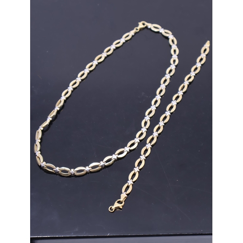 157 - An 18ct gold necklace and bracelet, total weight 36.9 grams