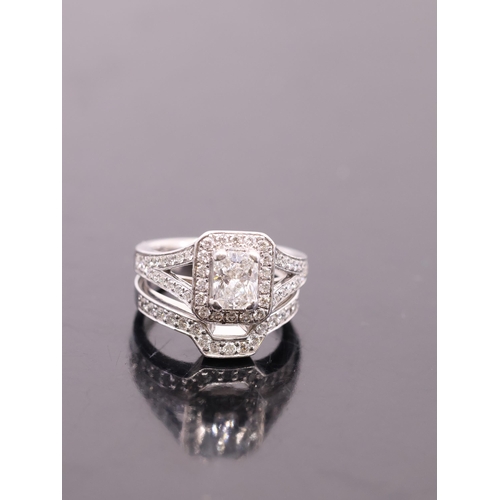 18 - A diamond solitaire and diamond set band, with a copy of a valuation from Padraic Lavin, which state... 