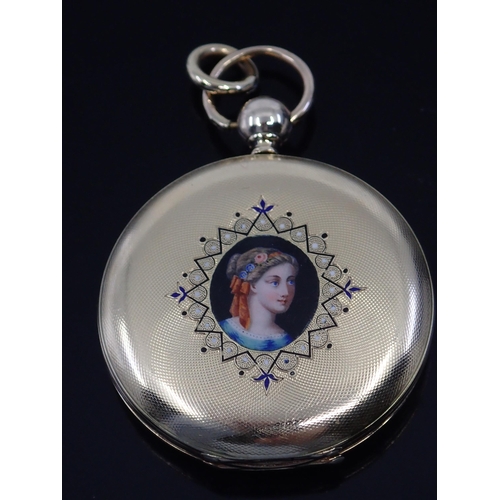 186 - A large gold fob watch decorated with a picture of a girl on one side and harp on the other approx. ... 