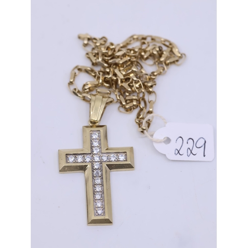 229 - A gold cross and chain