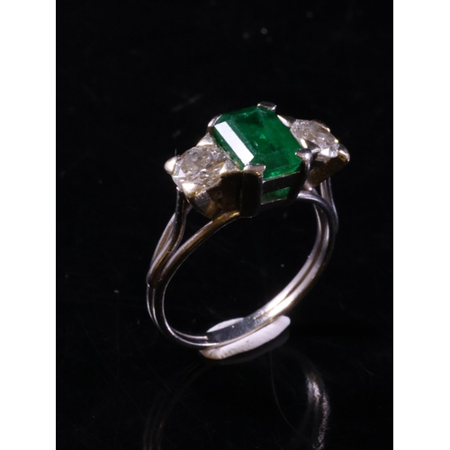 23 - An emerald and diamond three stone ring finger size M