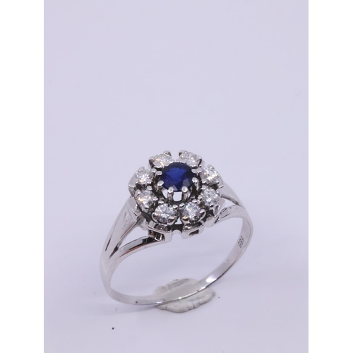 46 - A diamond and sapphire ring, showing as finger size T