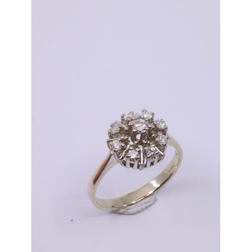 47 - A diamond cluster ring set in 14ct gold, showing as finger size M