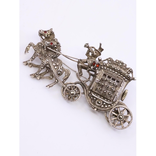 62 - A silver marquise clock brooch in the form of a carriage and with two horse