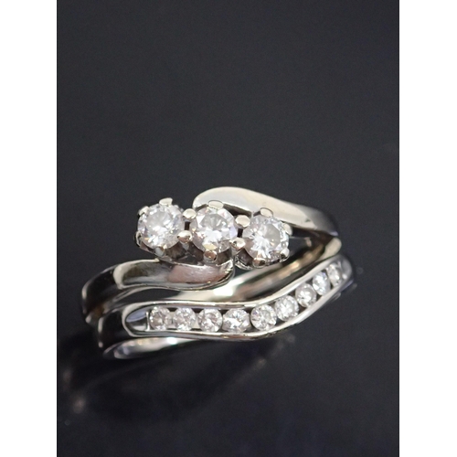 9 - A diamond three stone ring set in 18ct gold and a diamond set half eternity ring also set in 18ct go... 