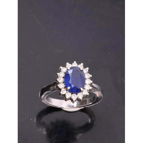 113 - A 18ct white gold cluster diamond and sapphire ring,  Finger size L