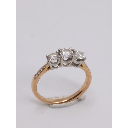 13 - A diamond three stone ring by Weirs set in 18ct gold finger size J Half