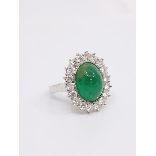 20 - A Cabochon emerald and diamond cluster ring, estimated weight of diamonds 1.50cts, finger size J