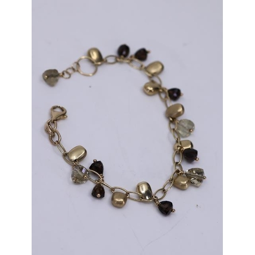 22 - A 9ct gold gem bracelet set approx. 12.3 grams