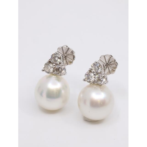 24 - A pair of diamond and southsea pearl earrings, total estimated weight of diamonds 1.85cts