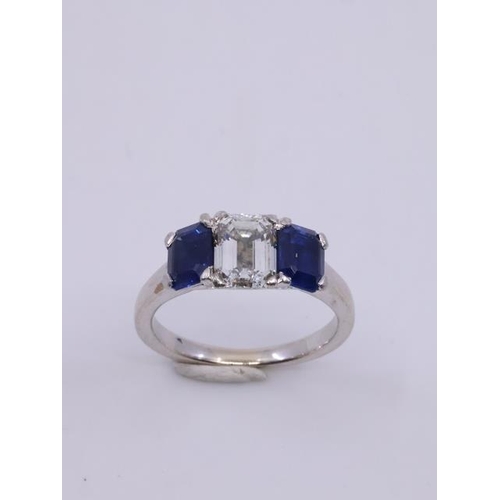 47 - A fine diamond and sapphire three stone ring finger size G half to H, the centre emerald cut diamond... 