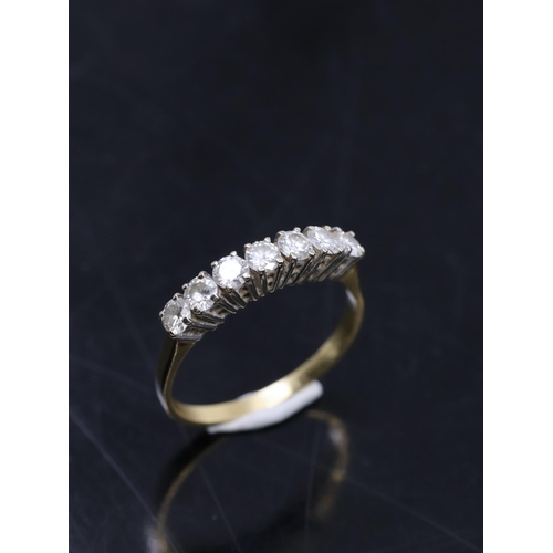 94 - A diamond seven stone ring set in 18ct gold. showing as finger size Q