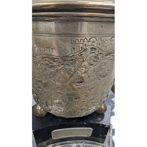 269 - A silver three handle cup approx 1138 grams on wooden plinth, the cup is hallmarked Chester 1902 by ... 