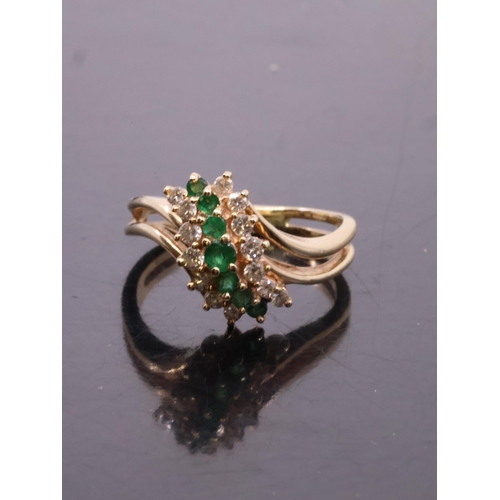 205 - An emerald and diamond cluster ring set in 14kt gold, with a copy of a valuation from Weirs which st... 