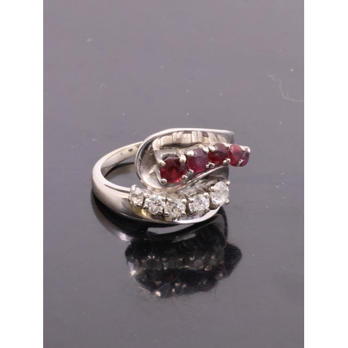 1 - A ruby and diamond cluster ring set in 18ct gold, finger size approximately N approx. 8.7 grams