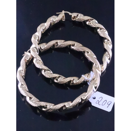 209 - A pair of large gold hoop earrings approx. 20.9 grams