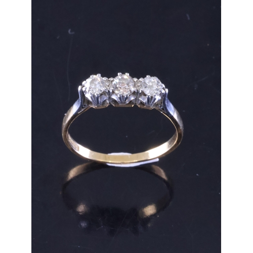 25 - A diamond three stone ring set in 18ct gold