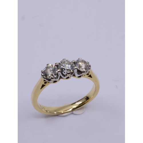 28 - A diamond three stone ring set in 18ct gold total estimated weight of diamonds 1ct, with a copy of a... 