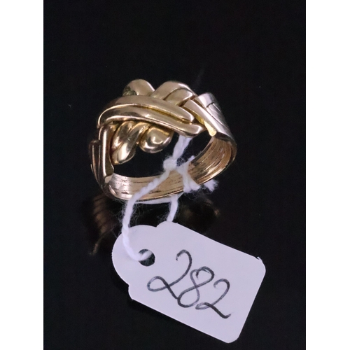 282 - A 14ct gold puzzle ring approx. 8.7 grams finger size R