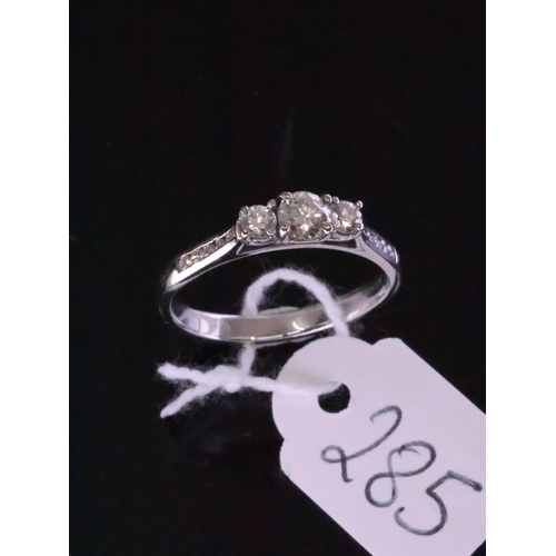 285 - An 18ct white gold diamond three stone ring, approx. 3.4 grams finger size P half