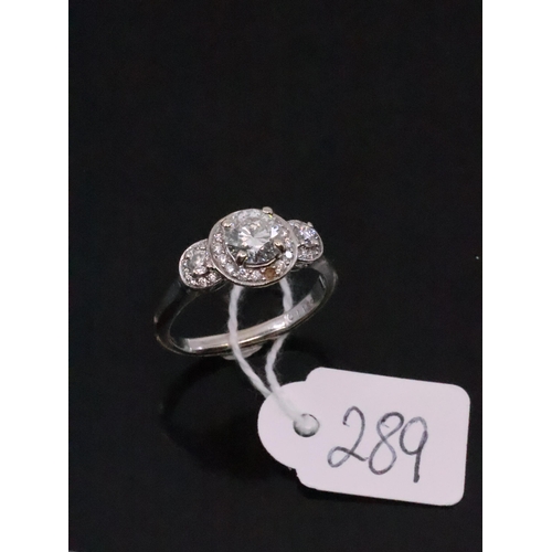 289 - An 18ct white gold diamond cluster ring, showing as finger size O and a half