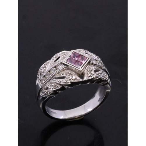 37 - A pink sapphire and diamond cluster ring set in 18ct gold finger size M