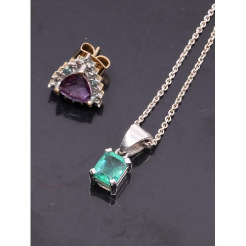 39 - An emerald set pendant on chain and one 9ct gold earring