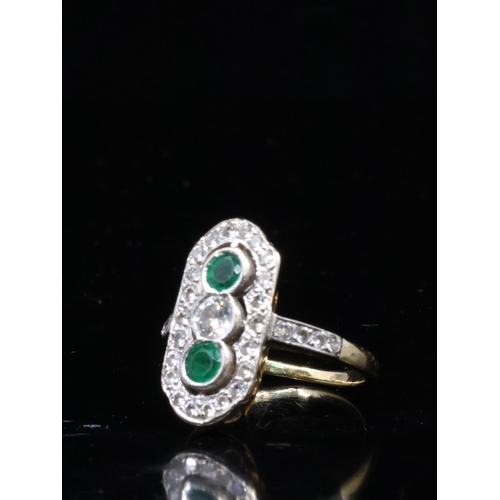 4 - An emerald and diamond cluster ring finger size K