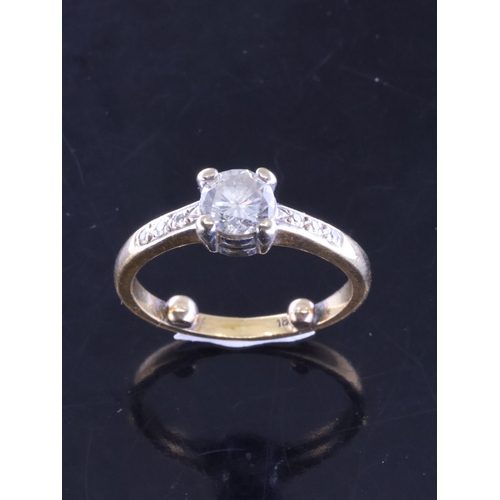 55 - A diamond solitaire ring set with diamond shoulders in 18ct gold, finger size H Half (ring spacers i... 