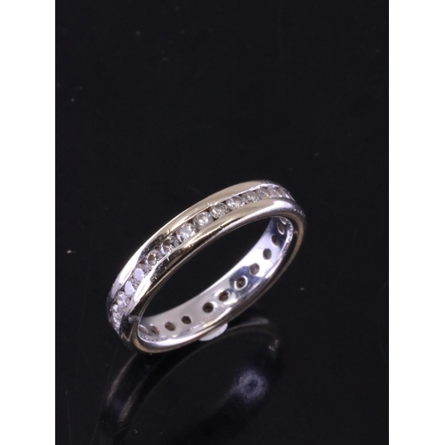 60 - A diamond full eternity ring approx. 4.2 grams  finger size  M and a half