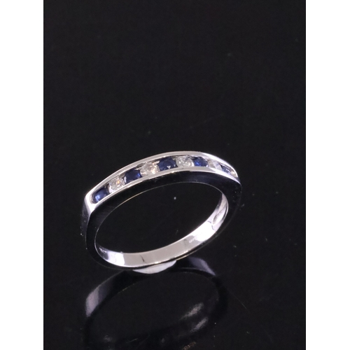 62 - A sapphire and diamond half eternity ring set in 18ct gold approx. 3.2 grams