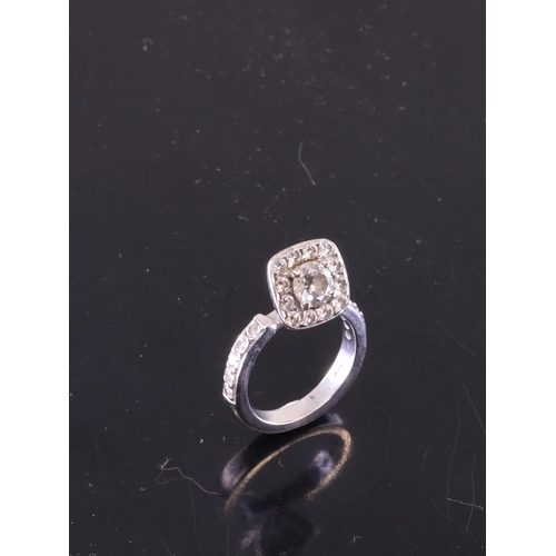 64 - A diamond cluster ring with an IGI certificate which states the diamond is 0.56cts H Colour and Si1 ... 